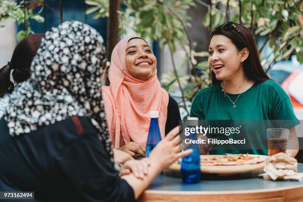 happy multi ethnic friends together - ethnic restaurant stock pictures, royalty-free photos & images