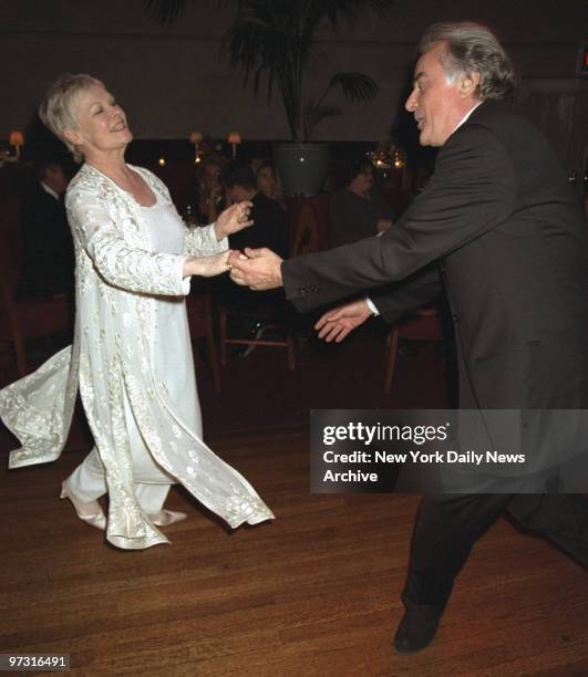 Star of show Judy Dench dances with show's producer Richard Eyre at opening night party at Laura Belle's for the play "Amy's View."