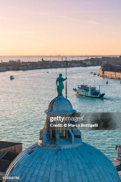 bronze statue on top of san giorgio maggiore, venice - canale della giudecca stock pictures, royalty-free photos & images