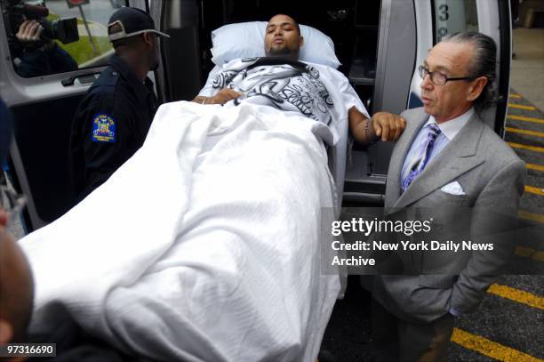 Joseph Guzman is accompanied by his attorney, Sanford Rubenstein, as he leaves Mary Immaculate Hospital, where he has been recovering since he was...