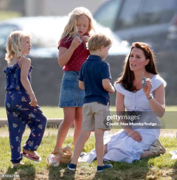 Isla Phillips, Savannah Phillips, Prince George of Cambridge and Catherine, Duchess of Cambridge attend the Maserati Royal Charity Polo Trophy at the...