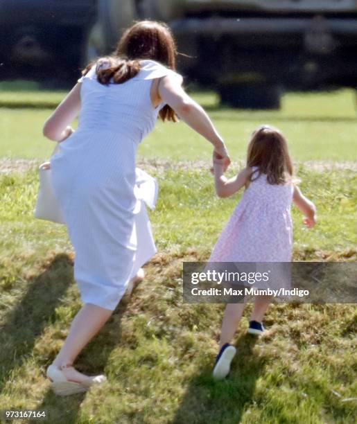 Catherine, Duchess of Cambridge and Princess Charlotte of Cambridge attend the Maserati Royal Charity Polo Trophy at the Beaufort Polo Club on June...