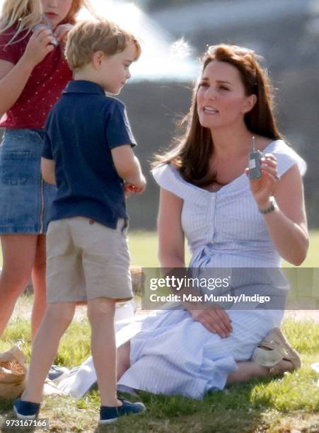 Prince George of Cambridge and Catherine, Duchess of Cambridge attend the Maserati Royal Charity Polo Trophy at the Beaufort Polo Club on June 10,...