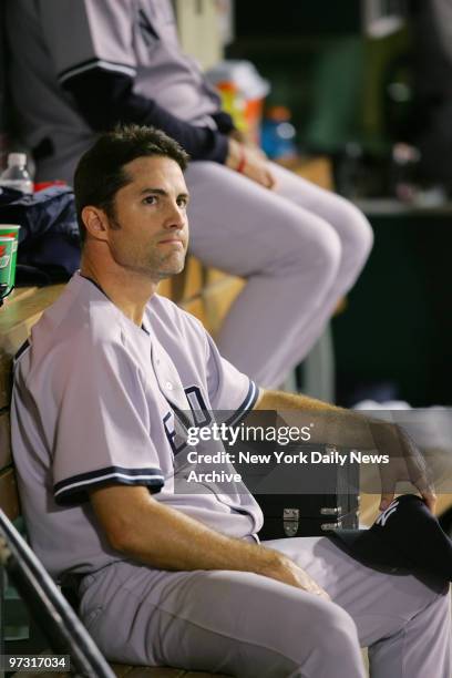 New York Yankees' starter Mike Mussina sits in the dugout at Angel Stadium after being relieved in the third inning of Game 5 of the American League...