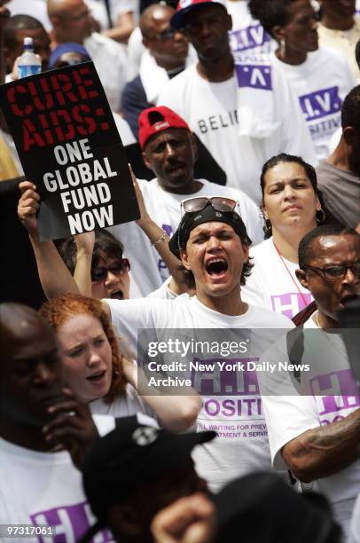 Josephine Perez yells as she joins other protesters during a rally outside the United Nations building to mark the 25th anniversary of the AIDS...