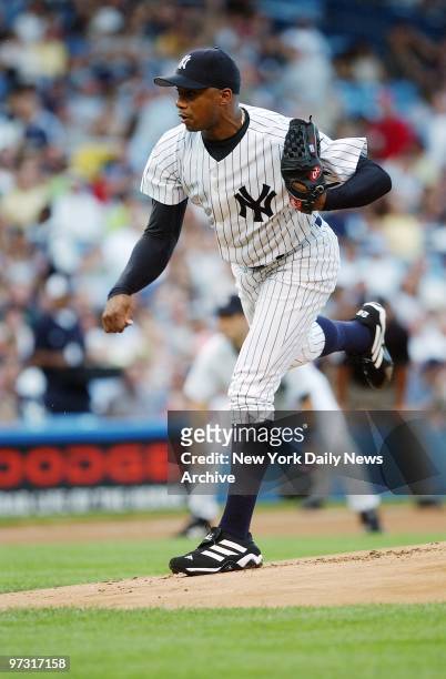 New York Yankees' starter Orlando Hernandez hurls a pitch against the Oakland A's during first inning of game at Yankee Stadium. Hernandez struck out...