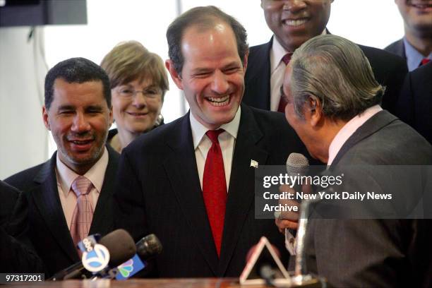 State Attorney General Eliot Spitzer shares a laugh with Rep. Charles Rangel during a news conference at the Adam Clayton Powell Jr. State office...