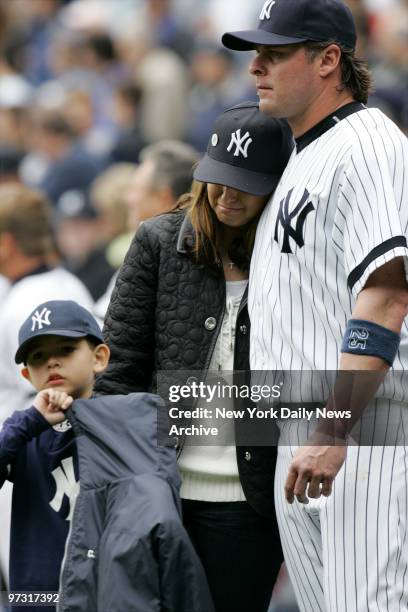 Melanie Lidle, widow of the late Corey Lidle, and their son Christopher stand with New York Yankees' Jason Giambi before throwing out the ceremonial...