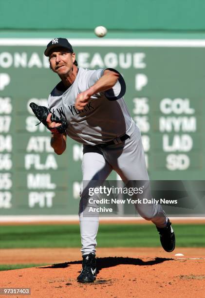 New York Yankees' starter Randy Johnson fires a pitch against the Boston Red Sox during the first inning of game at Fenway Park. Johnson allowed...