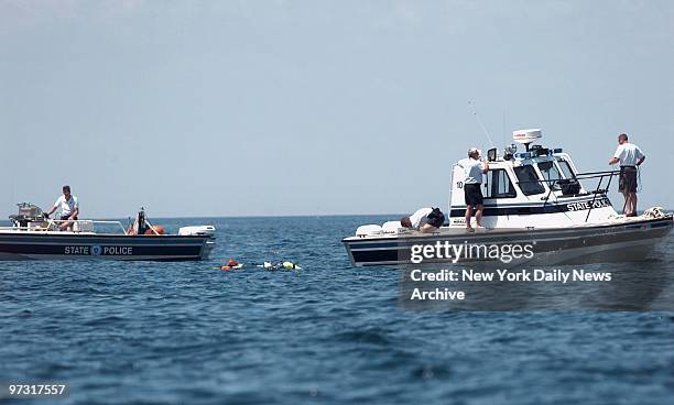 State police divers in the water about five miles off Gay Head as Coast Guard and police boats continue search for plane and bodies of John F....