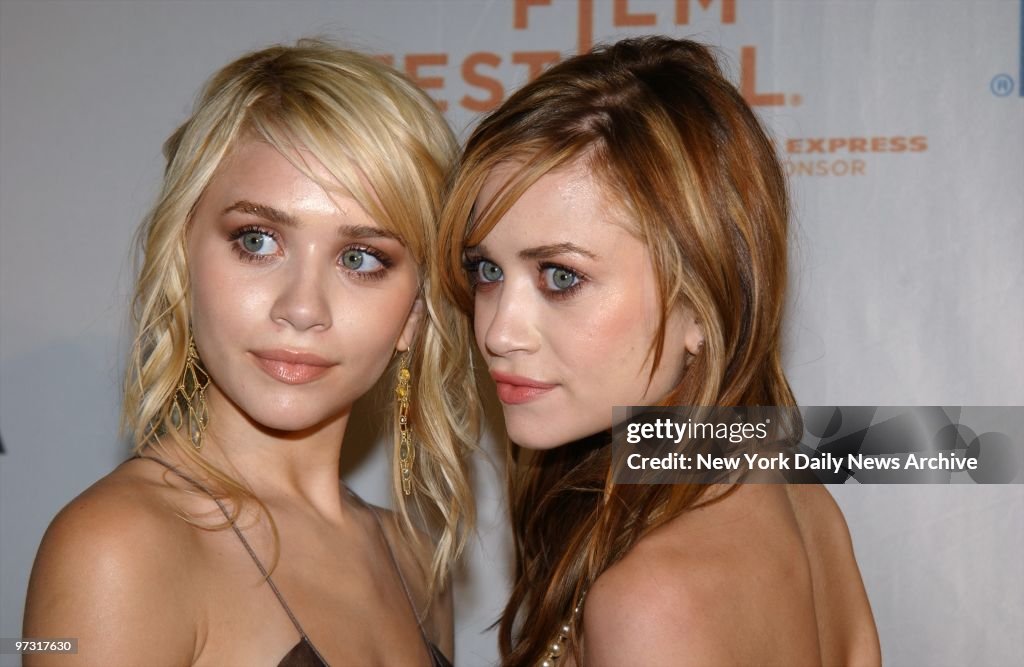 Twins Ashley (left) and Mary-Kate Olsen put their heads toge