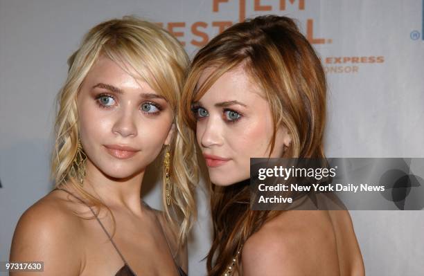 Twins Ashley and Mary-Kate Olsen put their heads together before a screening of the movie "New York Minute" at the Tribeca Family Film Festival. They...