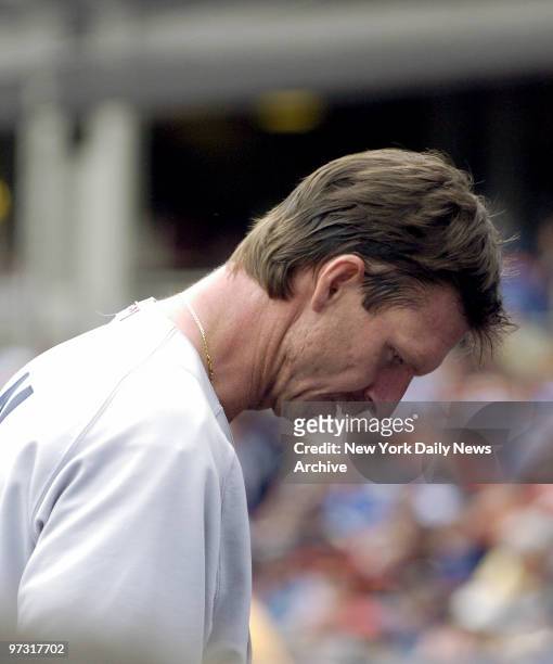 New York Yankees' starter Randy Johnson hangs his head as he returns to the dugout in the second inning of Game 2 of a three-game Subway Series...