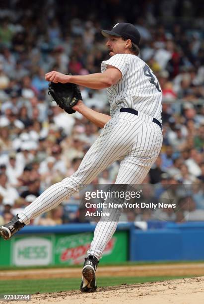 New York Yankees' starter Randy Johnson is on the mound against the Baltimore Orioles at Yankee Stadium. Johnson pitched seven innings, striking out...