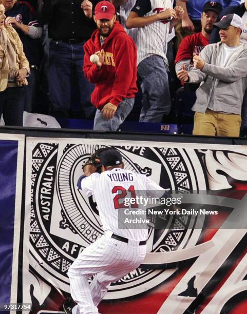 Delmon Young and Twins hit the wall as outfielder runs out of room and Jorge Posads's blast just clears the fence. The home run puts the Yankees...