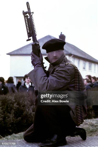 Gunman from the Provisional Irish Republican Army holds a US-made M60 machine gun during a demonstration in the Republican Creggan estate in...