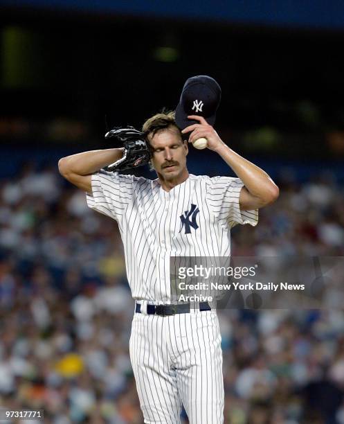 New York Yankees' starter Randy Johnson sweats it out during the last game of a three-game Subway Series against the New York Mets at Yankee Stadium....