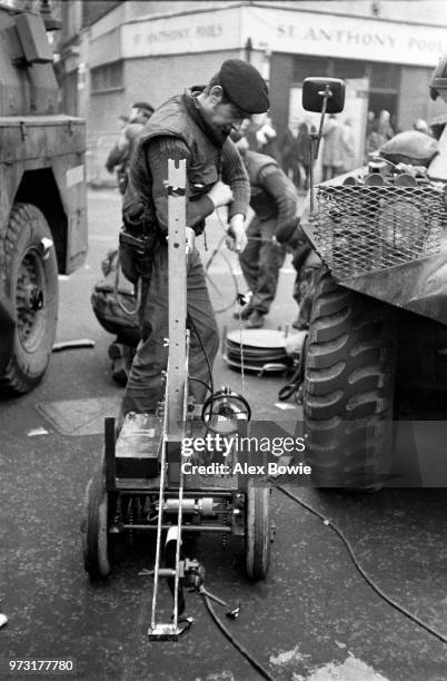 British Army bomb disposal robot, known as the Mk3 Wheelbarrow but nicknamed Goliath, is prepared for action by an ammunition technical officer of...