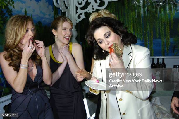 Delta Burke has a bite of cake while fellow cast members Rebecca Gayheart and Lily Rabe look on during a party at Tavern on the Green for the opening...