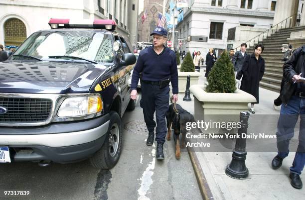 State Trooper Eric Donselaar, dressed in military-style garb, patrols the Broadway-Nassau-Fulton St. Hub in lower Manhattan with Gaylo, a 113-pound...