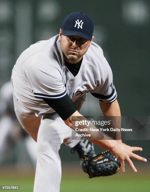 New York Yankees' starter Roger Clemens delivers a pitch in the first inning of a game against the Boston Red Sox at Fenway Park. The Yanks went on...