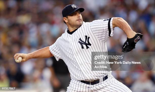 New York Yankees' starter Roger Clemens delivers a pitch in the second inning of a game against the Boston Red Sox at Yankee Stadium. The Rocket gave...