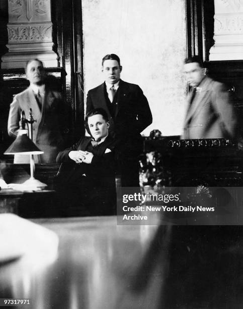 Two Gun Crowley sits on the witness stand surrounded by detectives during the Patrick O'Brien trial.