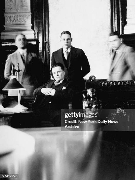 Two Gun Crowley sits surrounded by detectives on the witness stand during the Patrick O'Brien trial.