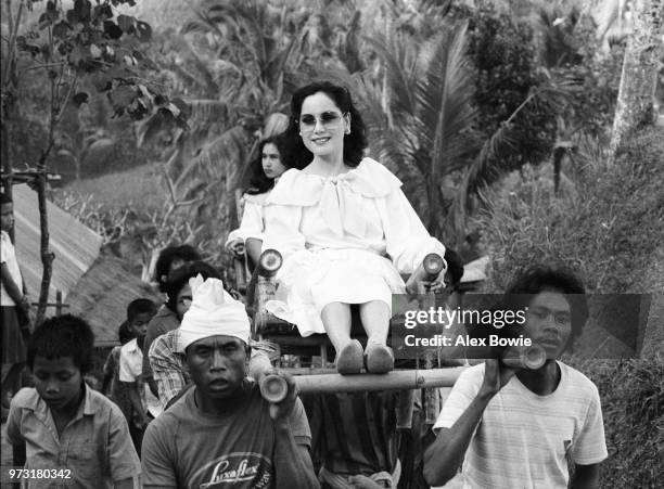 Dewi Sukarno, widow of Indonesia's founding president Sukarno, and daughter Kartika Soekarno tour the sacred royal grounds of Gunung Kawi on the...