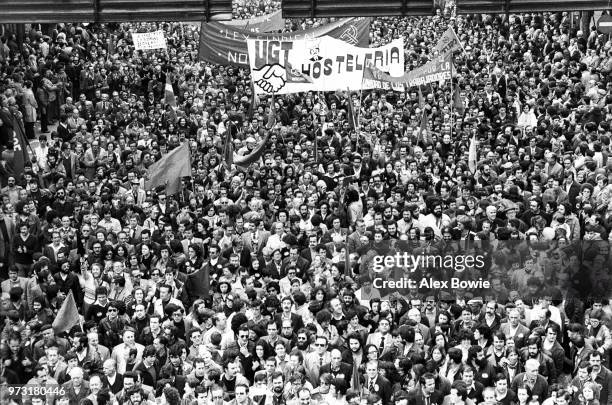 Thousands of workers gather in a May Day rally, Madrid, Spain, 1st May 1978. Banners from trade unions include the General Union of Workers .