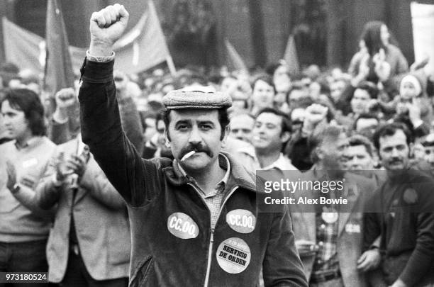 Thousands of workers gather to celebrate May Day, Madrid, Spain, 1st May 1978. Stickers on worker's jacket signifies membership of the Workers'...