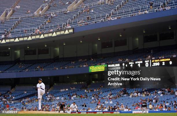 New York Yankees' starter Shawn Chacon delivers a pitch inside a nearly empty Yankee Stadium during the first inning of a game against the Florida...