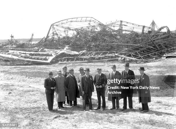 Members of the Board of Inquiry for the Department of Commerce look over ruins of the Hindenburg at Lakehurst as probe into the dirigible's...