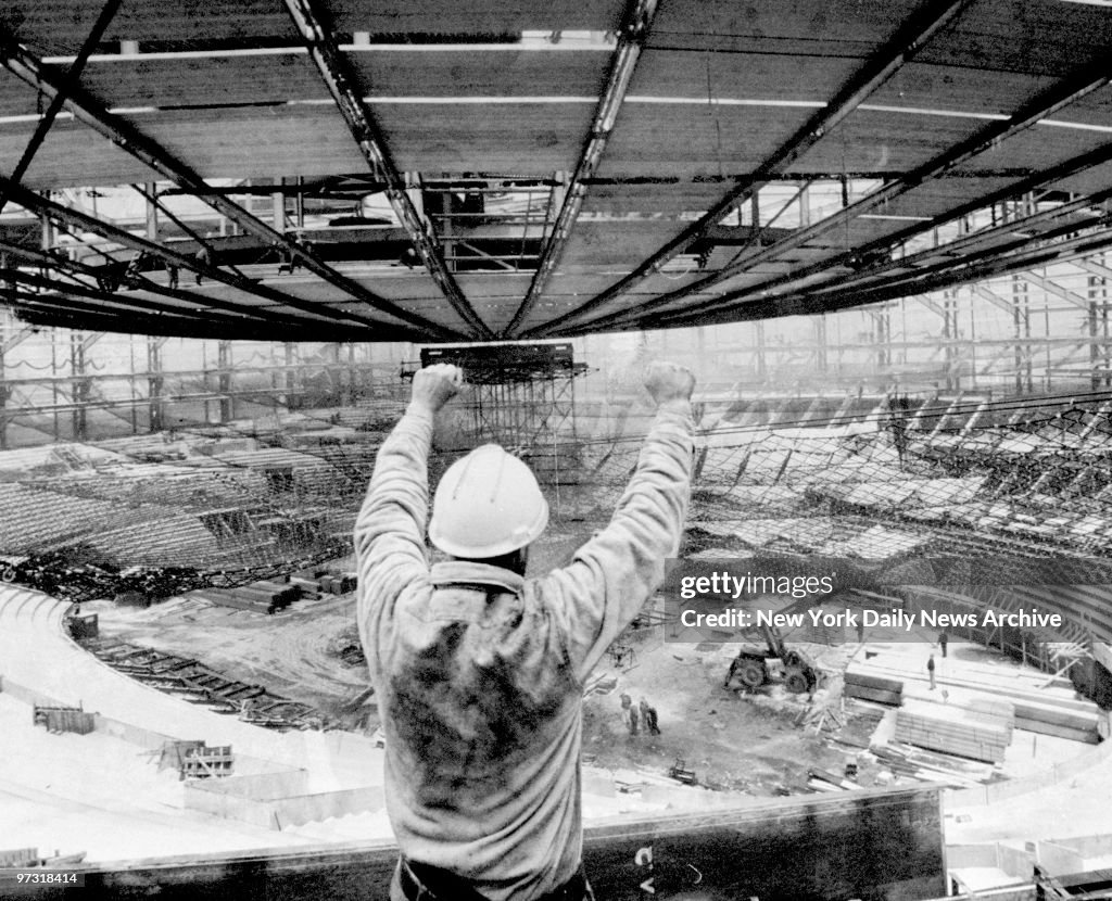 Steel worker giving the hold signal as the Madison Square Ga