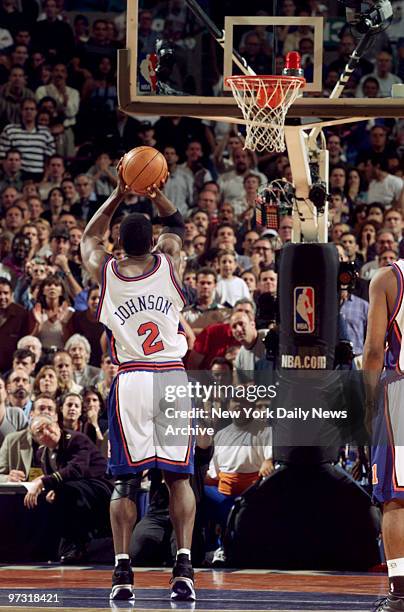 New York Knicks' Larry Johnson sinks a 3-pointer to tie the game and a foul shot to win against the Indiana Pacers in the Eastern Conference finals...