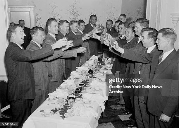 Members of the championship New York Football Giants raise their glasses in a toast at farewell breakfast at the Whitehall Hotel, on W. 100th St. At...