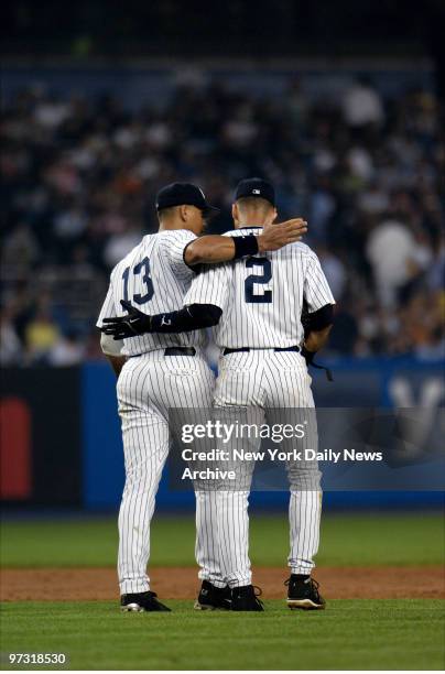 New York Yankees' third baseman Alex Rodriguez congratulates shortstop Derek Jeter after Jeter hit an infield single for his 2,000th career hit in...