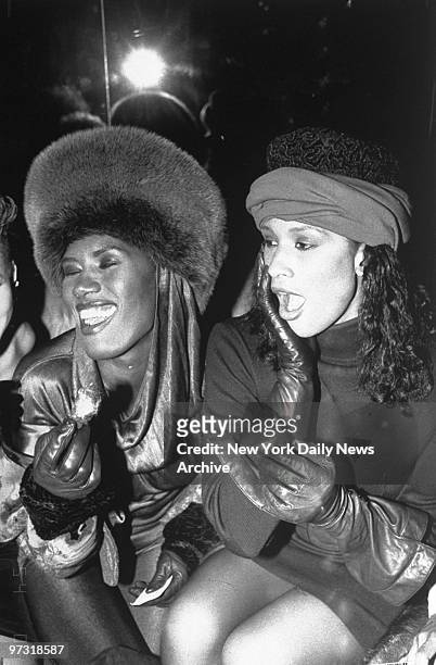 Grace Jones and model Beverly Johnson have a laugh at a party for the premiere of the movie "School Daze."