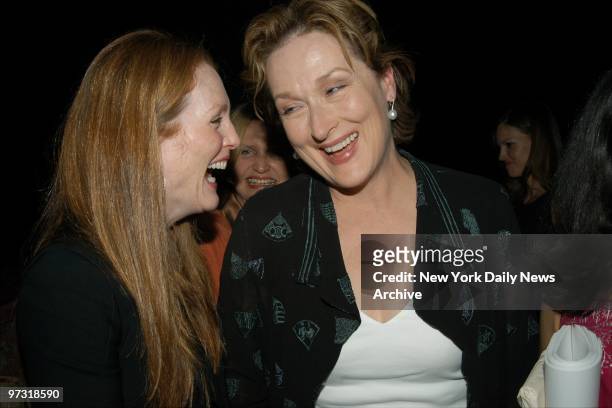 Julianne Moore and Meryl Streep share a laugh while at club Plaid for Glamour magazine's "Equality Now" benefit.