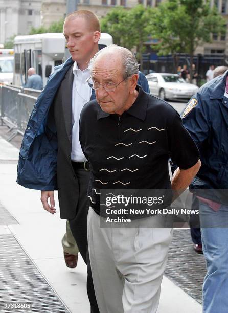 Julius Bernstein, the treasurer of Amalgamated Transit Union Local 1181, is escorted into F.B.I. Offices at Federal Plaza after federal agents and...