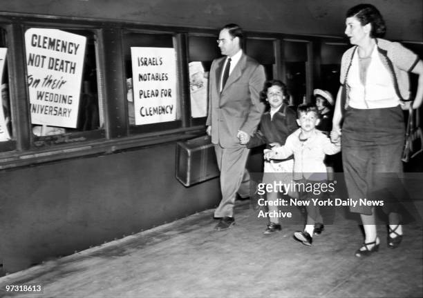 Supporters of Julius and Ethel Rosenberg on a train at Penn Station.