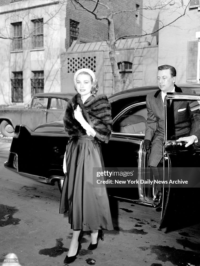 Grace Kelly, clad in a mink stole and topped off with a pink