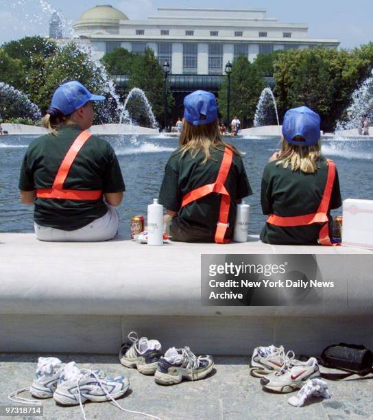 Members of the fifth grade safety patrol from Peniscola, Fla., cool their feet in fountain in the new sculpture garden at the National Gallery of Art...