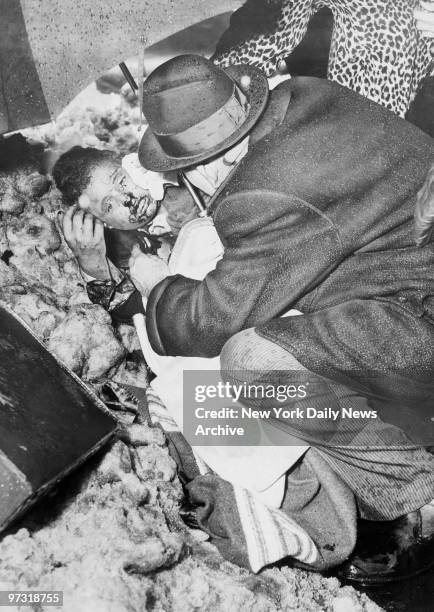 Stephen Baltz of Wilmette, IL, receives aid at Seventh Ave. Near Sterling Place, after a United Airlines DC-8 and a Trans World Airlines Super...