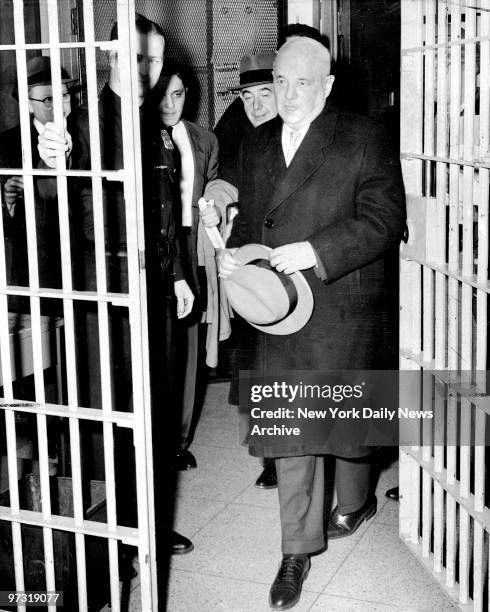 Judge Samuel Leibowitz leaves Kings County Hospital prison ward after hold a hearing on George Metesky, "The Mad Bomber."