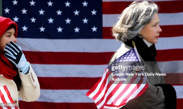 Two women carry American flags during the funeral for Army Ranger Sgt. James Regan at St. Mary's Roman Catholic Church in Manhasset on Friday. Sgt....