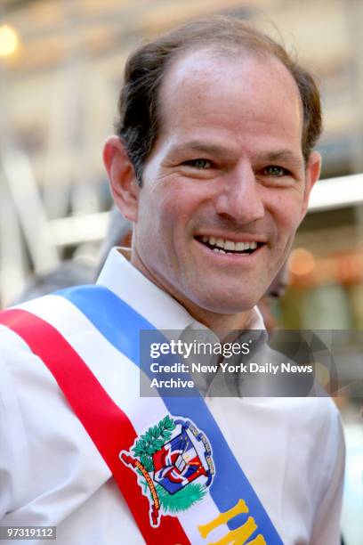 Democratic gubernatorial candidate Eliot Spitzer marches up Sixth Ave. As he joins revelers during the annual Dominican Day Parade.