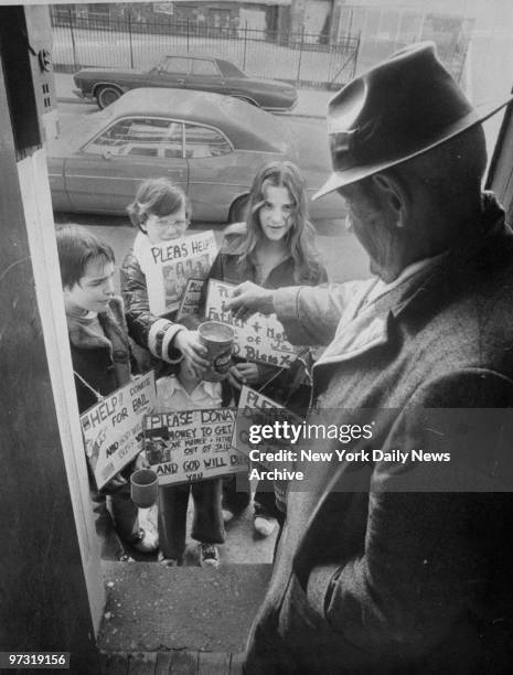 Members of the King-Romano family , Eric, 10; Michael and Jamie Marie collect money to bail their mother out of jail.