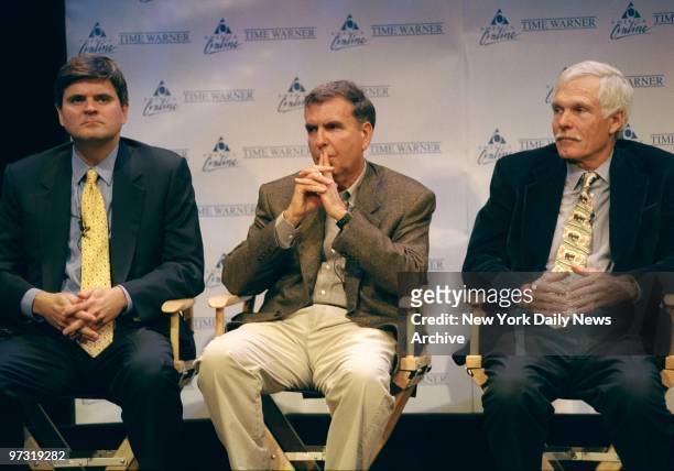 Steve Case , chairman and CEO of America Online, Gerald Levin , chairman and CEO of Time Warner, and Ted Turner, vice chairman of Time Warner, get...