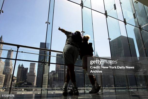 Judith Hay and Robert Tortorici of Florida look out over Ground Zero on the day before the third anniversary of the Sept. 11 terrorist attack on the...